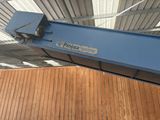 a blue crane that is hanging from the ceiling