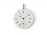 a white clock with roman numerals on the face