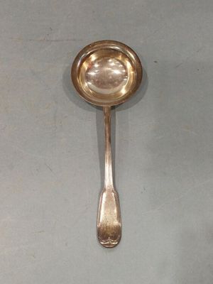 a spoon and a spoon rest on a table