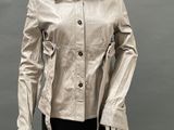 an image of a mannequin mannequin wearing a silver jacket and black pants