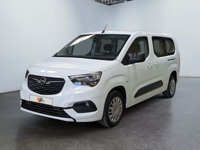 a white van parked in a room with a ceiling fan