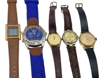 several different types of watches are lined up on a white surface