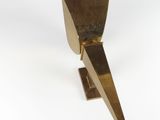 an image of a metal object on a white surface with a white background
