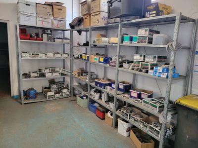 a room filled with lots of boxes and shelves