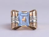 an image of a ring with a blue topaz stone