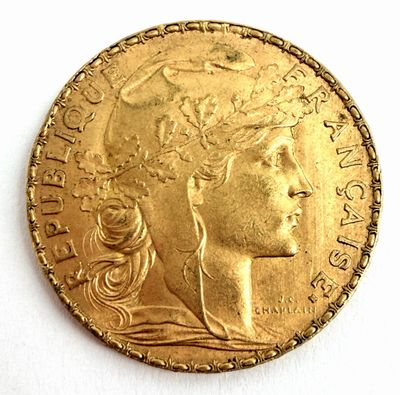 l'image d'une pièce d'or sur laquelle figure une tête de femme