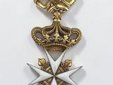 a close up of a medal on a white surface