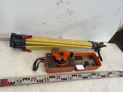 a measuring tape and a level on the floor