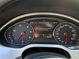 a close up of a car dashboard with a speedometer and gauges
