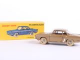 an old toy car and box of toys on a white surface