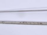 an image of a sword and a ruler on a white surface