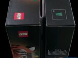 two boxes that have legos on them on a black background