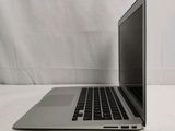 a laptop that is sitting on a white surface