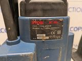 a close up of a blue machine with a black handle
