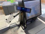 a computer monitor sitting on a desk in a store