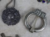 many different pieces of jewelry that are on the table