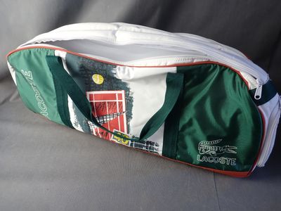 a green and white bag with a red door on it