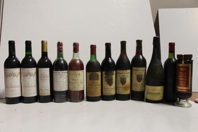 many bottles of wine lined up on a table