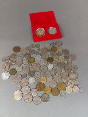 a red box filled with silver and gold coins