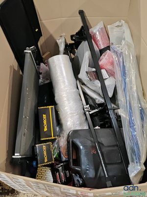 a cardboard box filled with assorted items in it