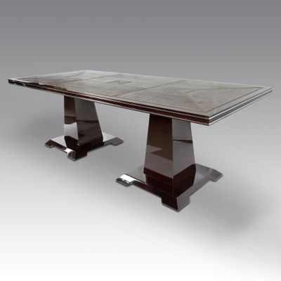 une photo d'une table à manger moderne avec un plateau en marbre