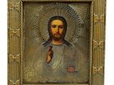 une image représentant un tableau de Jésus dans un cadre doré