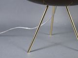 a close up of a table with a lamp on it