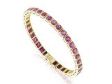 une bague en or jaune sertie de saphirs roses