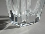 a clear glass vase sitting on a white surface