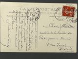 une vieille carte postale sur laquelle figure la photo d'un homme