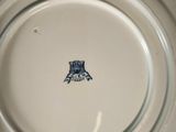 a white plate with a blue and white design on it