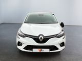 the front view of a white car in a white room