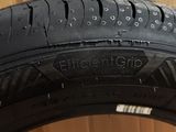 a close up of a tire on a box with a cardboard box in the background