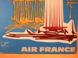 an air france poster on the wall of a room