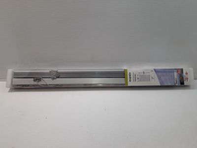a tube of toothbrush sitting on a white surface