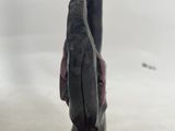 a close up of a statue of a person holding a knife