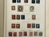 an open book with a bunch of different stamps on it