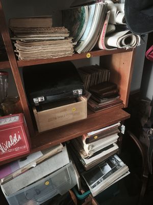 a book shelf with a lot of books on top of it
