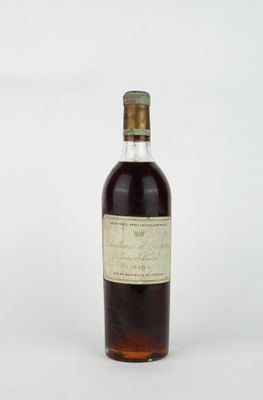 a bottle of liquor sitting on top of a white surface