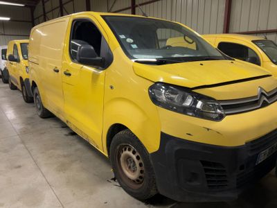 a yellow van that is parked in a garage