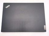 a laptop that is sitting on a white surface