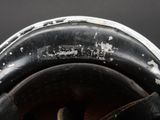 a close up of a helmet with a hole in it