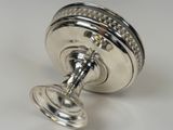 a silver object that is sitting on a table