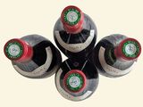 six bottles of wine are arranged in a circle on a white surface