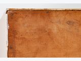 a wooden box that is sitting on a white surface