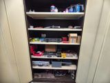 a closet with a lot of items on the shelves