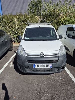 a white van parked in a parking lot next to other cars