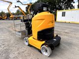 a yellow machine that is sitting in the dirt