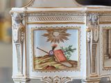 a small white box with a picture of a bird on it