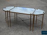 an image of a table with a glass top and metal legs